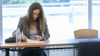 CPTR Faculty member reading a document